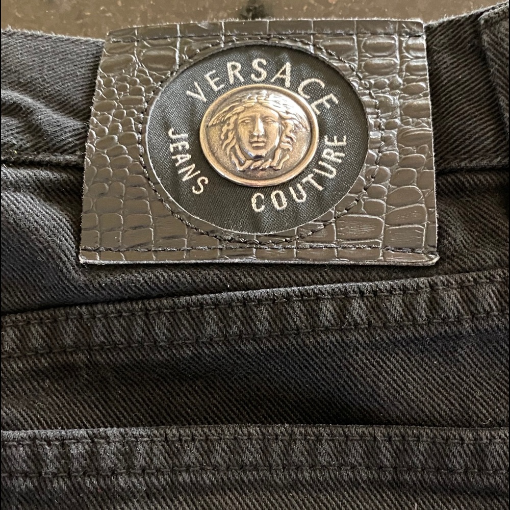 Versace black jeans.